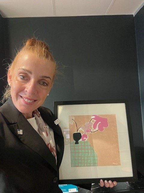 Tuckers funeral director with a picture frame