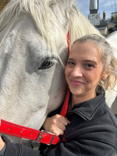 Tuckers funeral director holding the horse