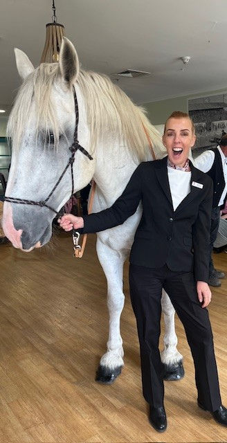 Tuckers funeral director holding the horse