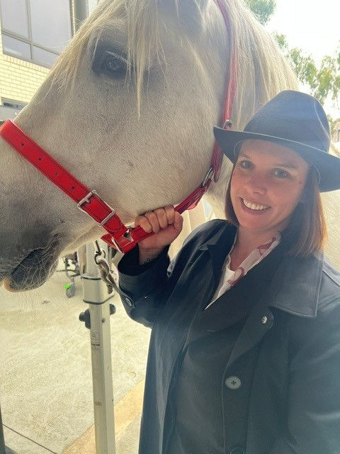Tuckers funeral director holding the horse
