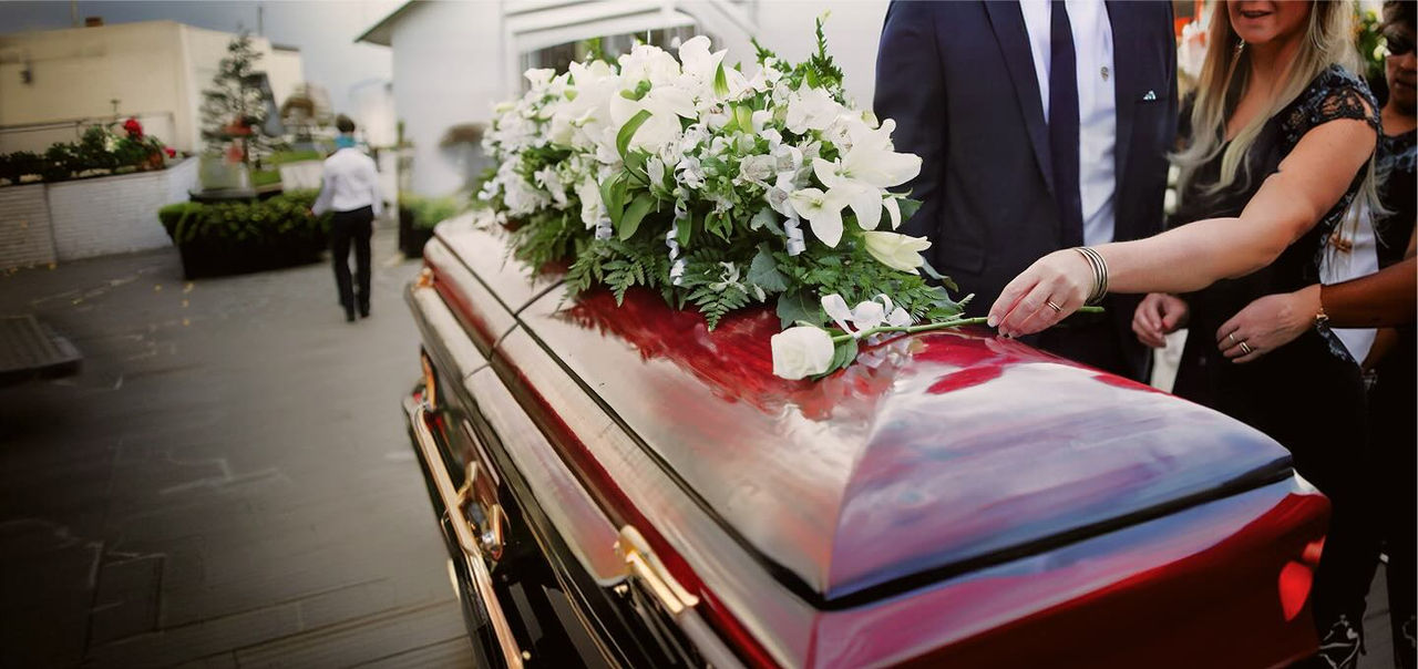 coffin with flower arrangement