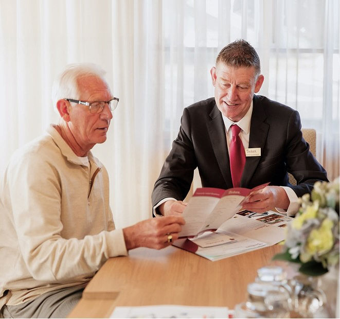 Tuckers funeral director with man