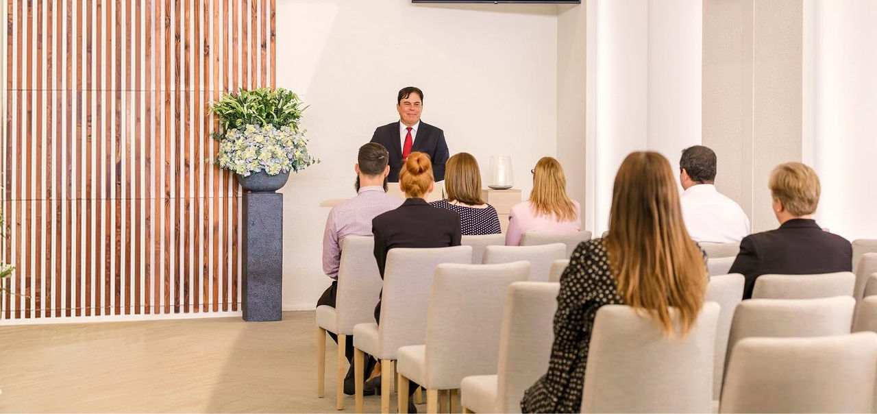man doing a eulogy at a funeral service