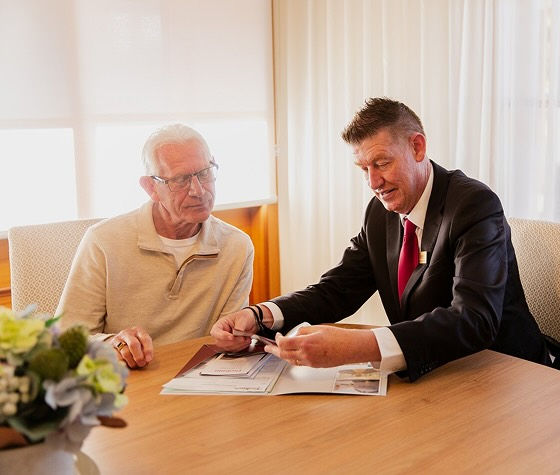 Tuckers funeral director with man