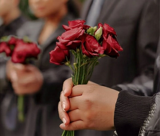a person holding a bouquet of flowers