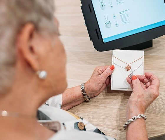 a woman looking at jewellery