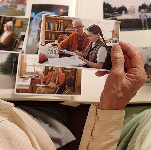 a person holding photos