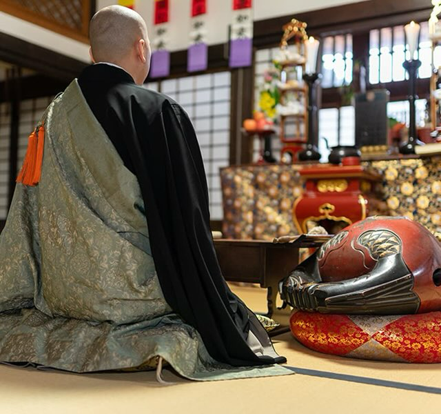 buddhist monk conducting memorial service