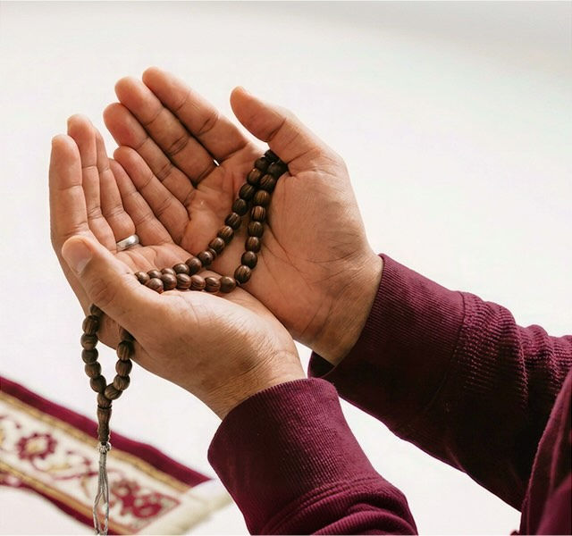 a person holding a rosary