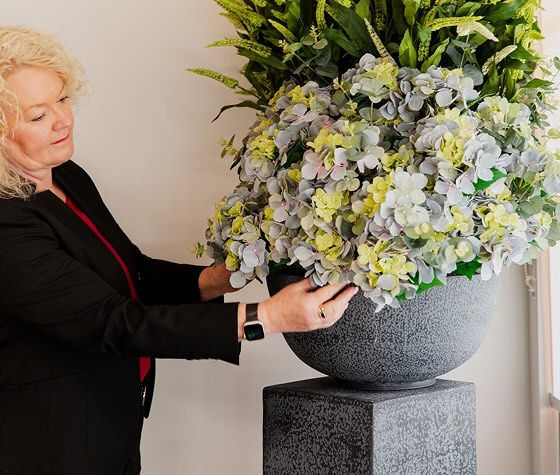 Tuckers funeral director arranging flowers