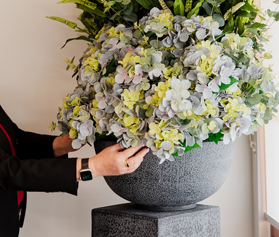 Tuckers funeral director arranging flowers