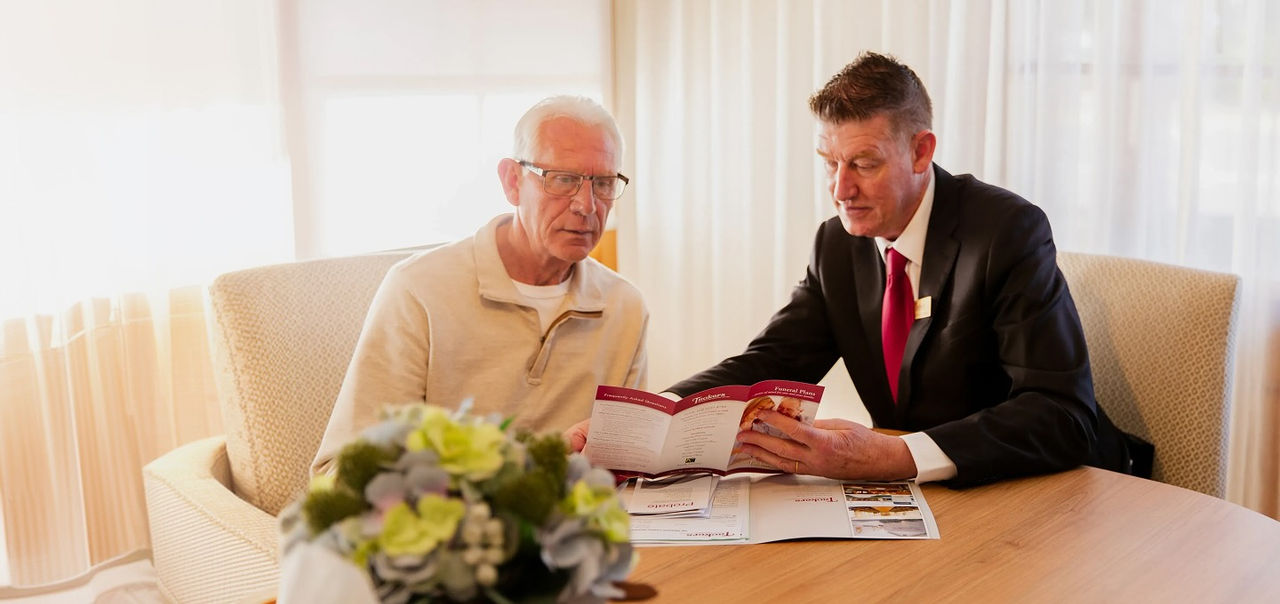 Tuckers funeral director with man